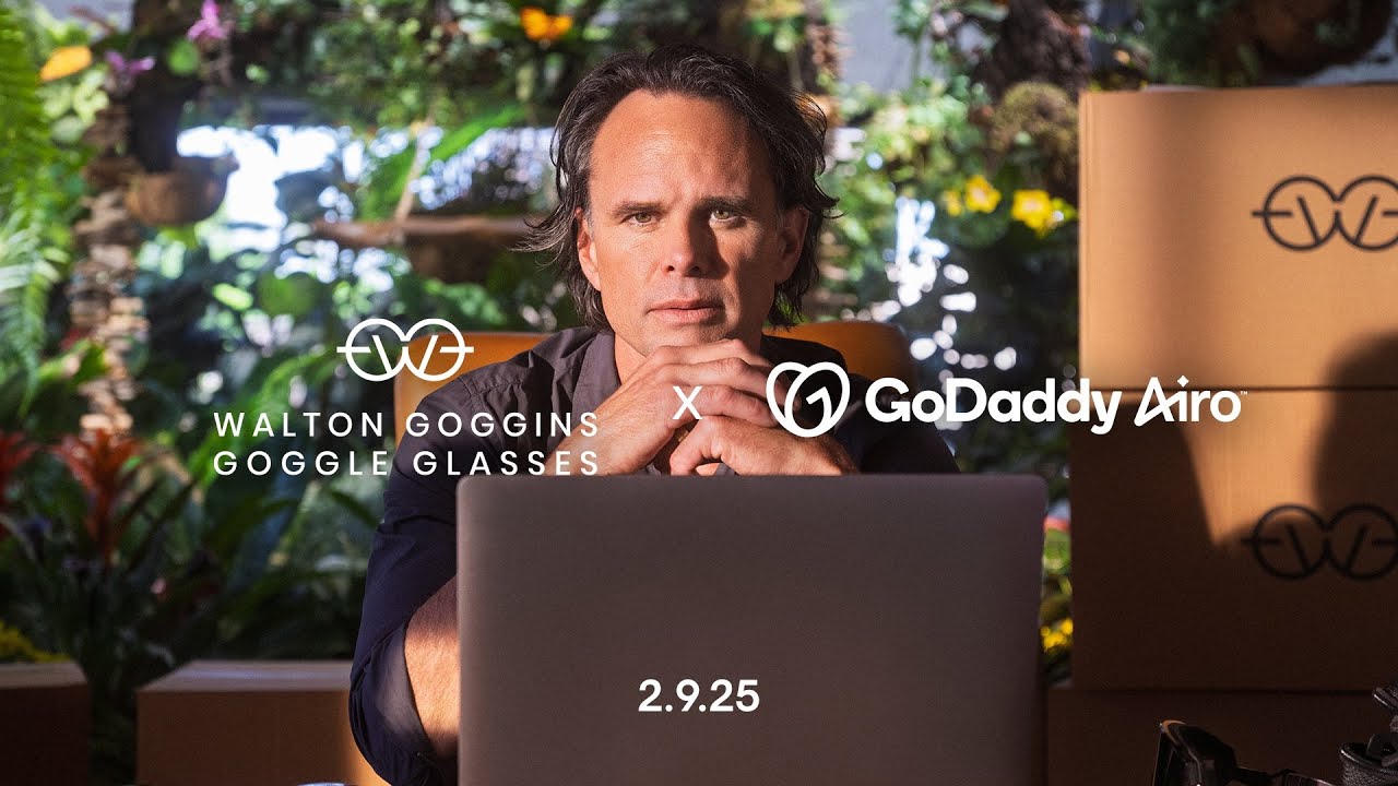 GoDaddy Airo 2025 Super Bowl campaign key art: actor Walton Goggins seated at a laptop, with the 'Walton Goggins Goggle Glasses × GoDaddy Airo' lockup and the date 2.9.25.